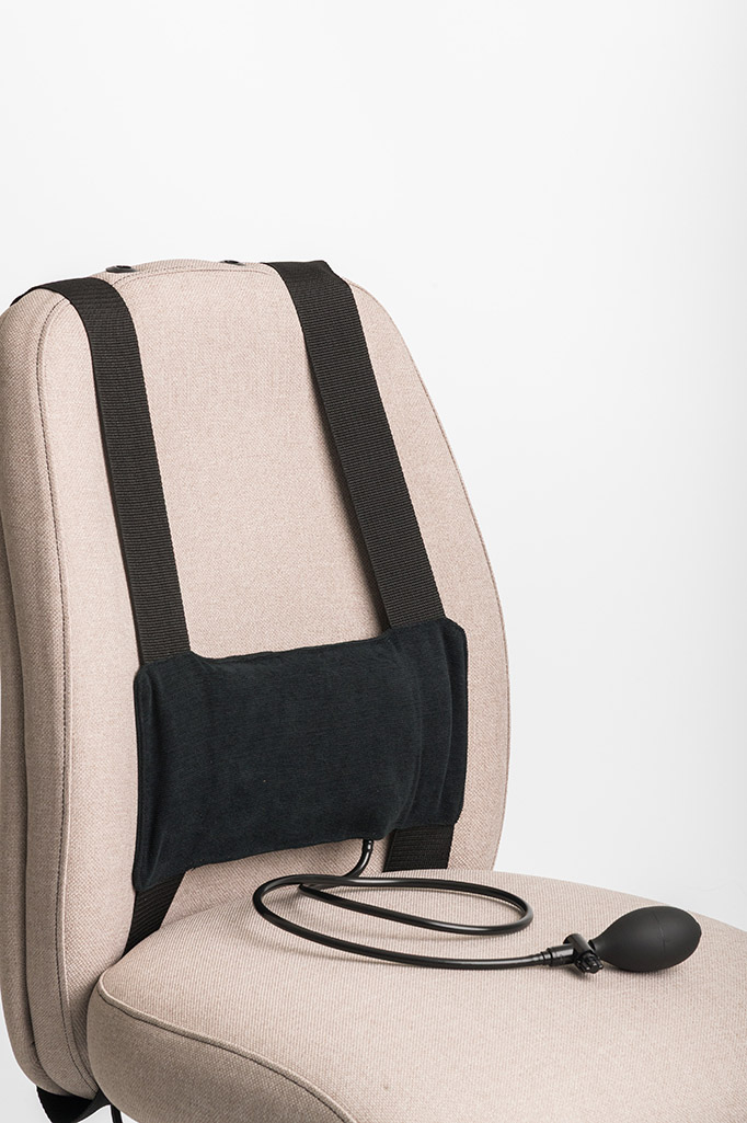 Actyv portable reactive lumbar support strapped to a chair backrest with inflation bulb