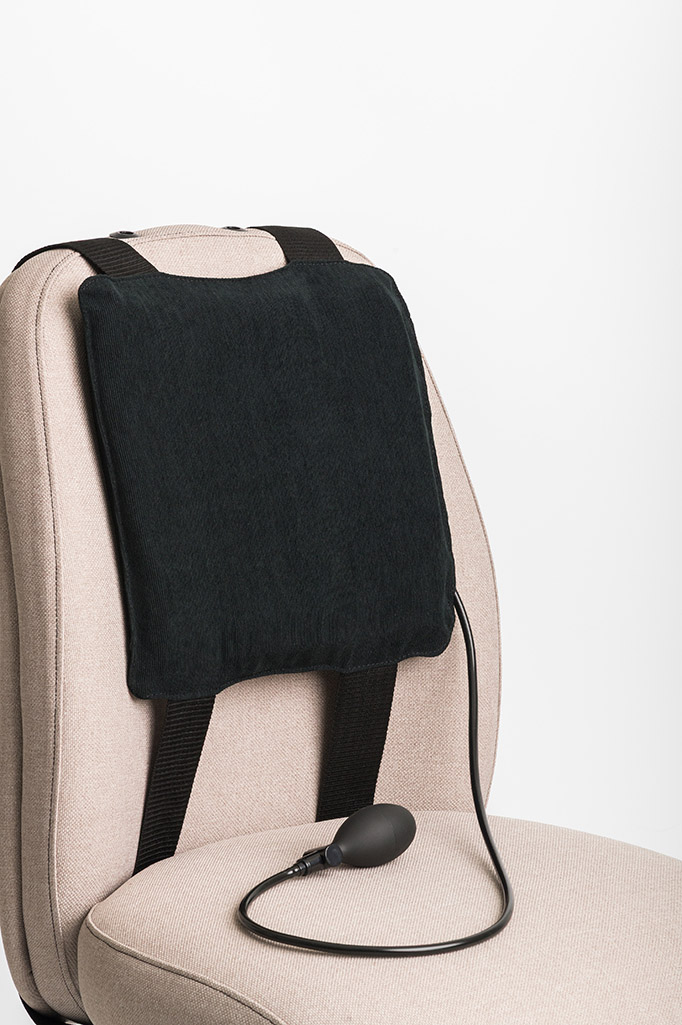Actyv portable lumbar support fitted to a chair backrest with inflation bulb