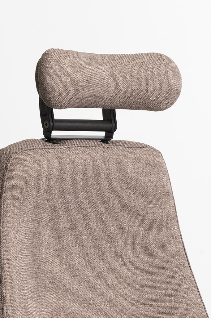 Close-up of Ergochair neck roll adaptation in brown upholstery fitted to chair backrest