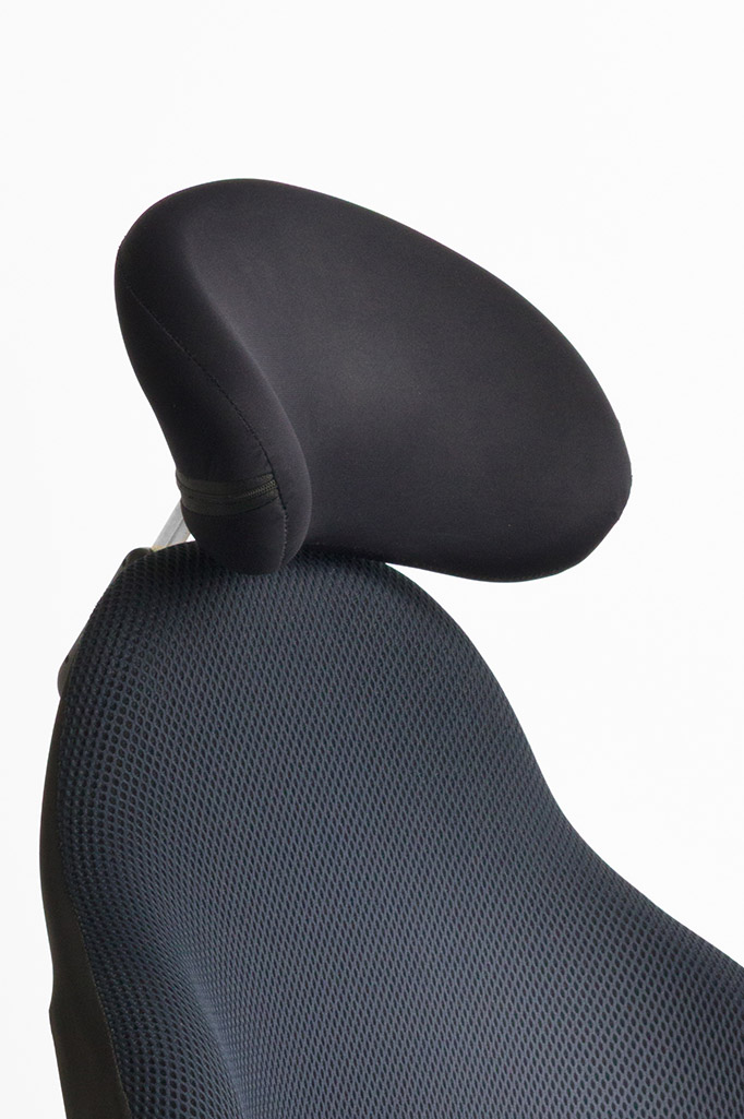 Close-up of Ergochair head rest adaptation in black upholstery fitted to mesh chair backrest
