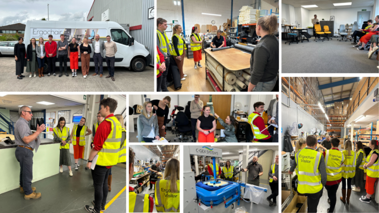 Ergochair team and visitors in high-visibility vests on a factory tour of the Ergochair manufacturing facility.